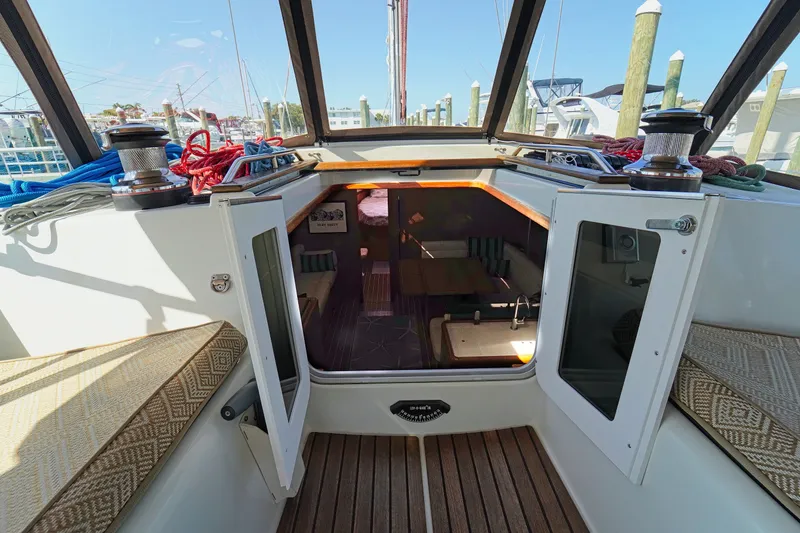 Slide: The Image of Interior view of 2011 Jeanneau Sun Odyssey 50 DS sailboat, showcasing cabin entrance and seating. - 17