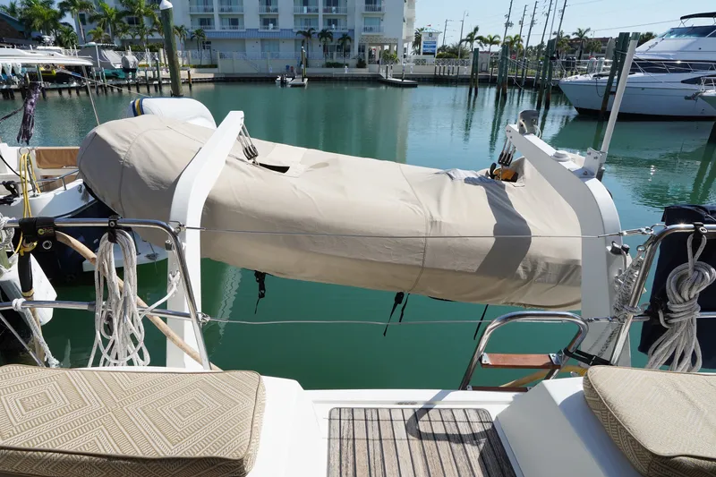 Slide: The Image of Jeanneau Sun Odyssey 50 DS 2011 yacht with covered dinghy at marina. - 14