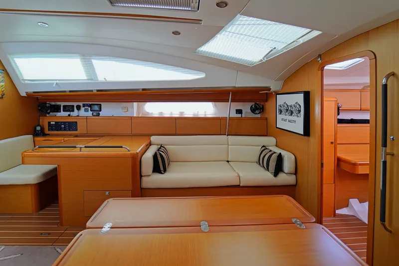 Slide: The Image of Interior of 2011 Jeanneau Sun Odyssey 50 DS yacht with modern furnishings and ample natural light. - 24