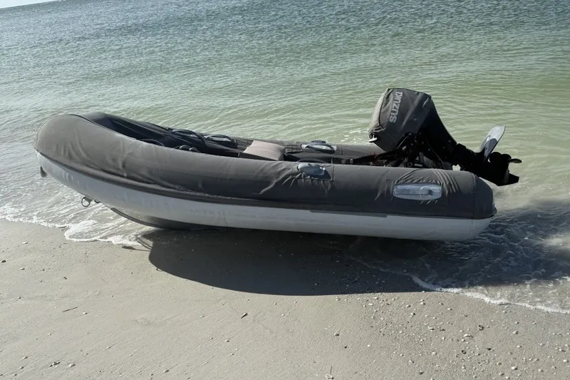 Slide: The Image of Inflatable boat with motor on sandy beach, Jeanneau Sun Odyssey 50 DS, 2011 model. - 40