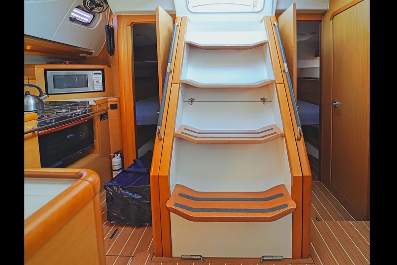Slide: The Image of Interior of 2011 Jeanneau Sun Odyssey 50 DS yacht with stairs and kitchen area. - 19