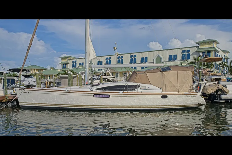 Slide: The Image of 2011 Jeanneau Sun Odyssey 50 DS yacht docked at marina with blue sky backdrop. - 5