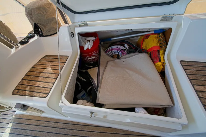 Slide: The Image of Storage compartment on a 2011 Jeanneau Sun Odyssey 50 DS sailboat, filled with boating gear. - 15