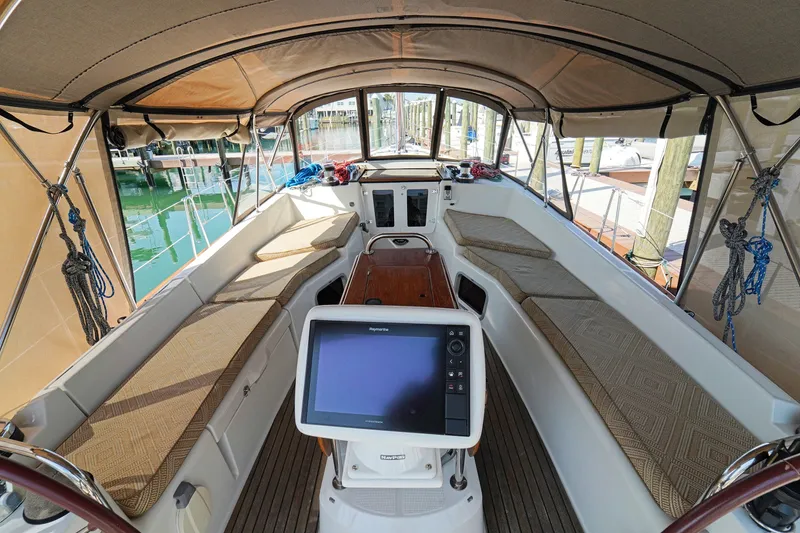 Slide: The Image of Interior view of 2011 Jeanneau Sun Odyssey 50 DS sailboat cockpit with seating and navigation equipment. - 11