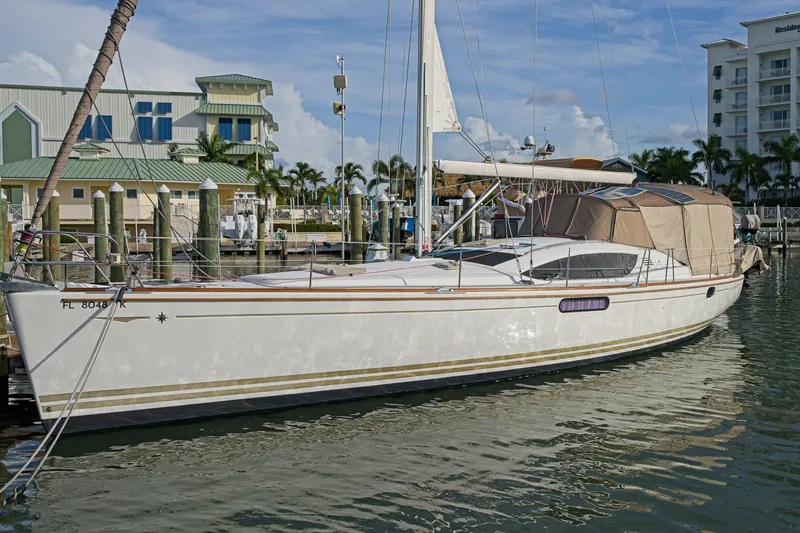 Slide: The Image of 2011 Jeanneau Sun Odyssey 50 DS sailboat docked at a marina, sunny day. - 1
