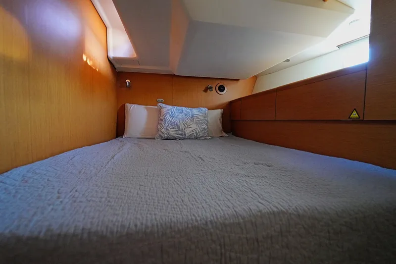 Slide: The Image of Cozy cabin interior of 2011 Jeanneau Sun Odyssey 50 DS sailboat with comfortable bedding. - 34