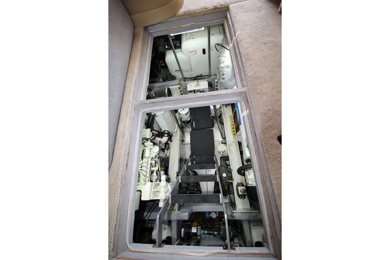 Slide: The Image of Engine compartment of a 2004 Silverton 410 Sport Bridge yacht, showcasing mechanical components. - 35