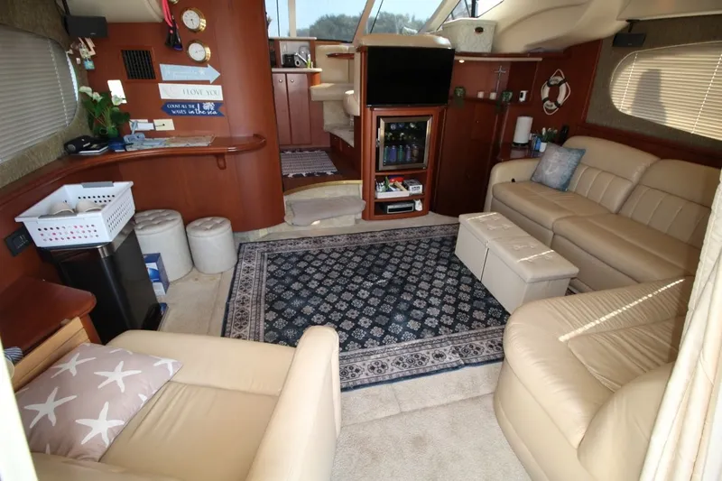 Slide: The Image of Luxurious interior of a 2004 Silverton 410 Sport Bridge yacht with elegant furnishings. - 22