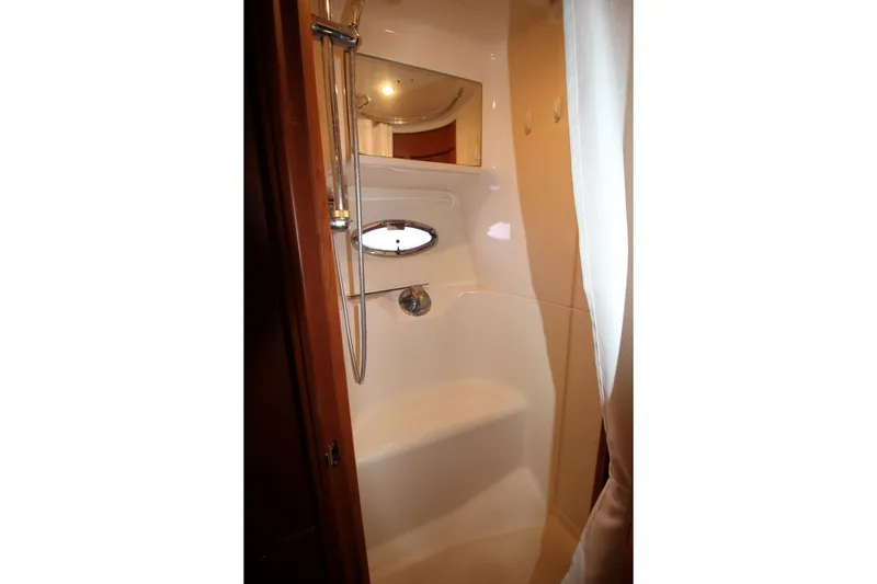 Slide: The Image of Shower area inside 2004 Silverton 410 Sport Bridge yacht, featuring a sleek design. - 32