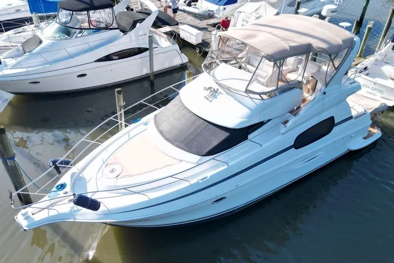 Slide: The Image of 2004 Silverton 410 Sport Bridge yacht docked at marina, aerial view. - 0