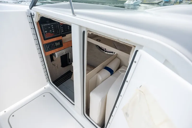 Slide: The Image of 2008 Formula 310 Bowrider cabin interior with seating and control panel. - 25