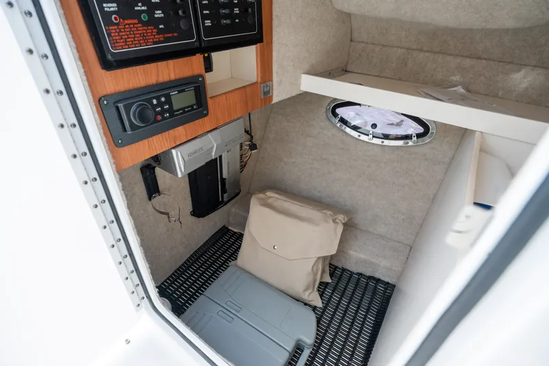 Slide: The Image of Interior cabin of 2008 Formula 310 Bowrider with control panel and storage. - 24