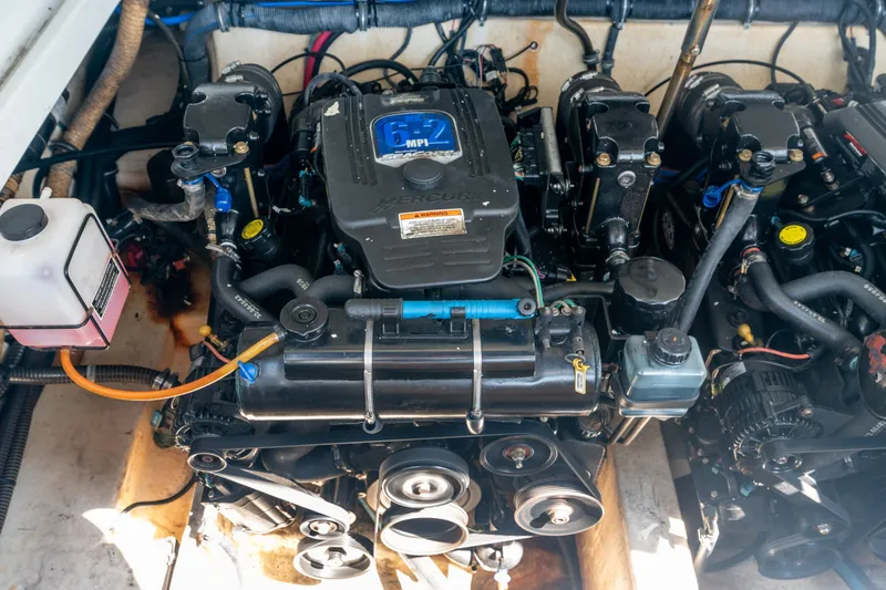 Slide: The Image of Engine compartment of a 2008 Formula 310 Bowrider boat, featuring a MerCruiser 6.2 MPI engine. - 43