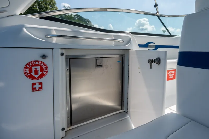 Slide: The Image of 2008 Formula 310 Bowrider interior with safety equipment and storage compartment. - 35