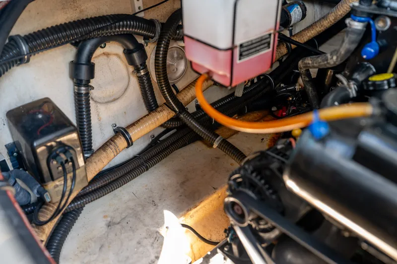 Slide: The Image of Engine compartment of a 2008 Formula 310 Bowrider, showing hoses and components. - 46