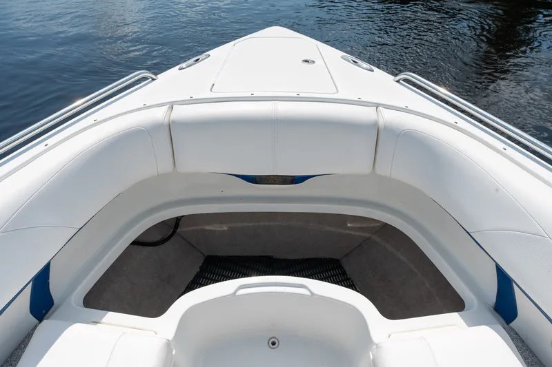 Slide: The Image of 2008 Formula 310 Bowrider boat interior with white seating and water view. - 14