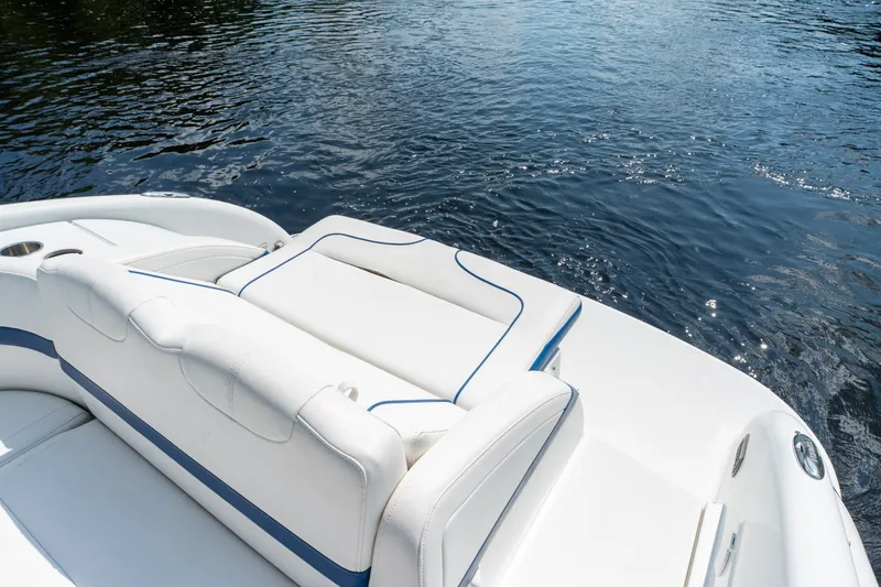 Slide: The Image of 2008 Formula 310 Bowrider boat with white seating on calm water. - 41