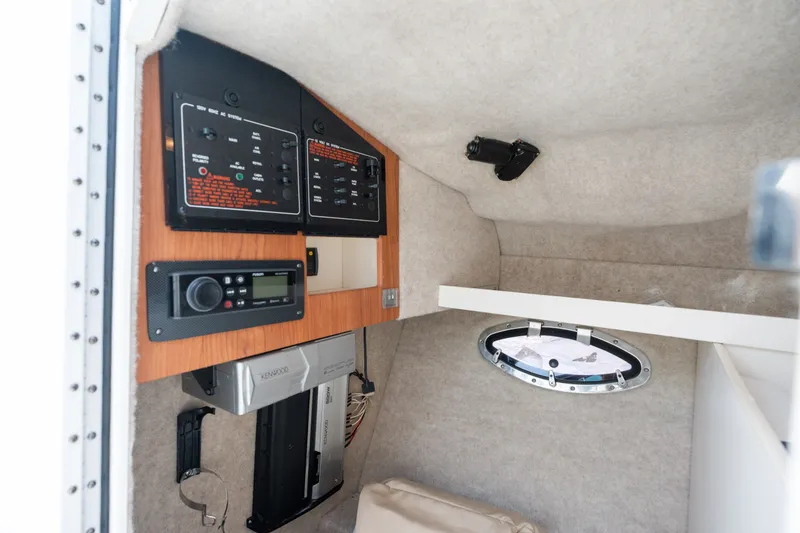 Slide: The Image of Interior of a 2008 Formula 310 Bowrider boat showing control panels and equipment. - 23