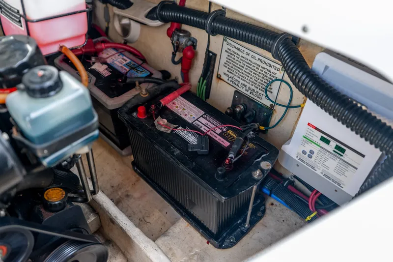 Slide: The Image of 2008 Formula 310 Bowrider engine compartment with batteries and wiring. - 45