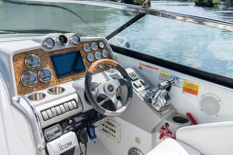 Slide: The Image of Dashboard of a 2008 Formula 310 Bowrider boat with steering wheel and controls. - 28