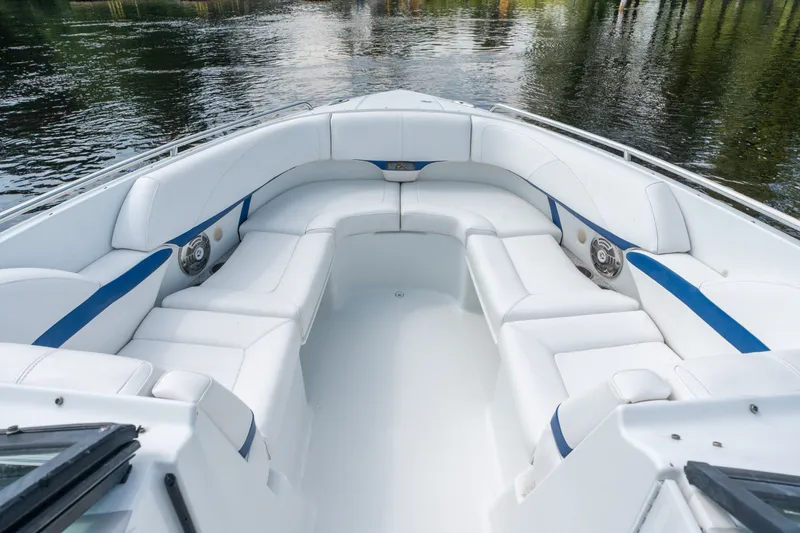 Slide: The Image of 2008 Formula 310 Bowrider with spacious white seating on calm water. - 11