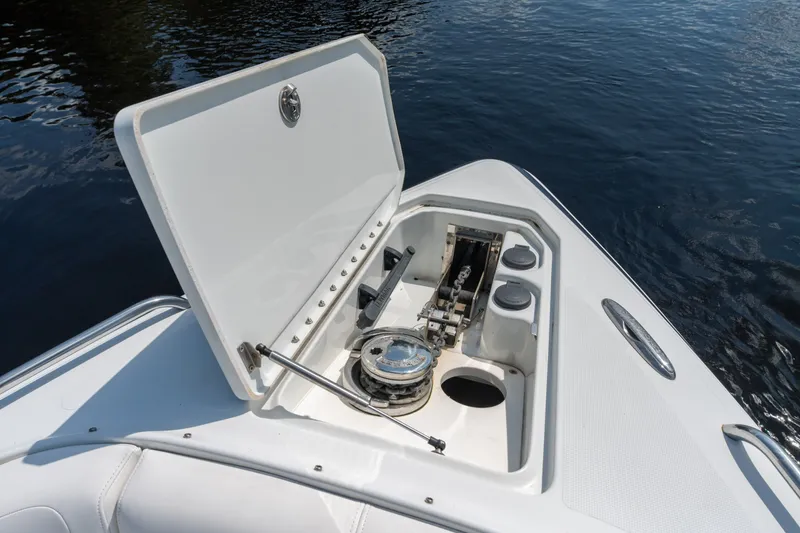 Slide: The Image of Open anchor compartment on 2008 Formula 310 Bowrider boat, showing anchor mechanism. - 17