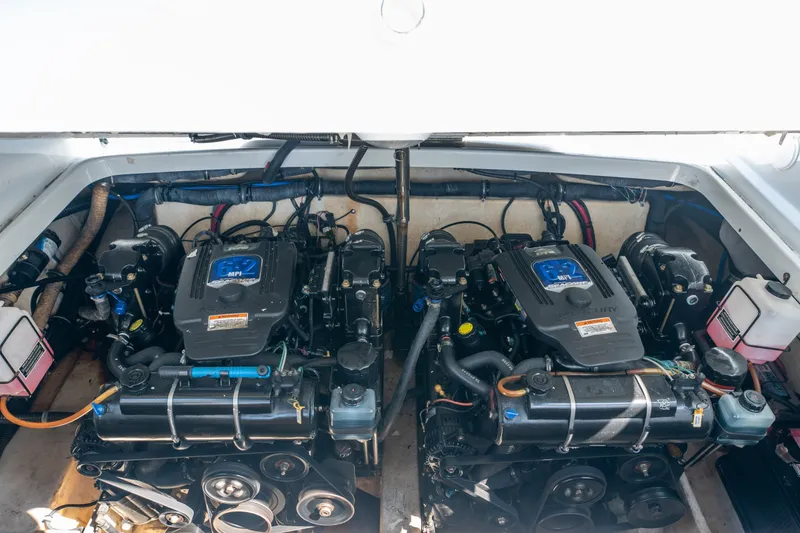 Slide: The Image of Engine compartment of a 2008 Formula 310 Bowrider boat, featuring dual engines. - 42