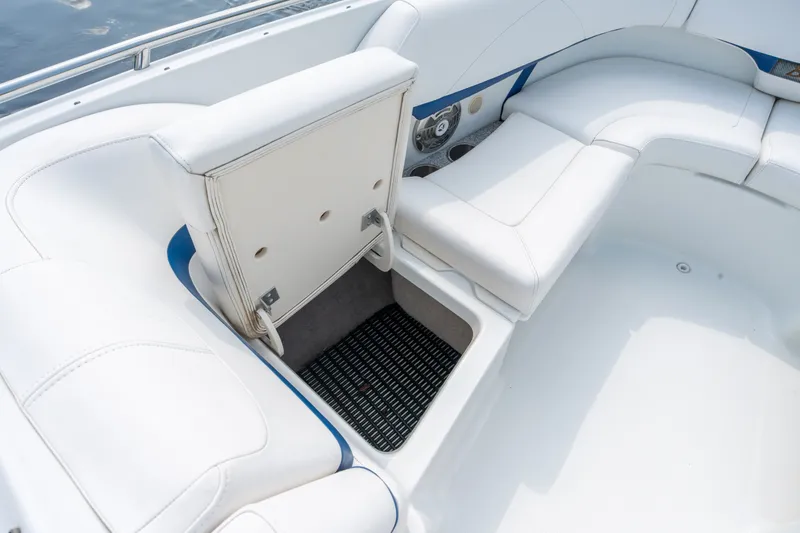 Slide: The Image of 2008 Formula 310 Bowrider interior with white seating and storage compartment. - 15