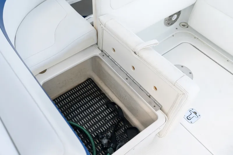 Slide: The Image of Storage compartment in 2008 Formula 310 Bowrider boat with white seating. - 36