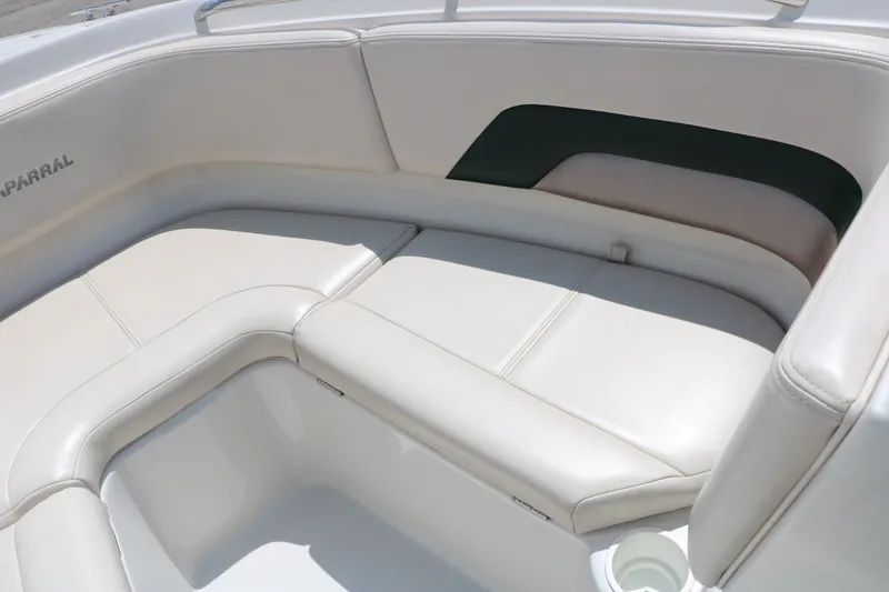 Slide: The Image of 1997 Chaparral 2130 SS boat interior with white cushioned seating. - 28