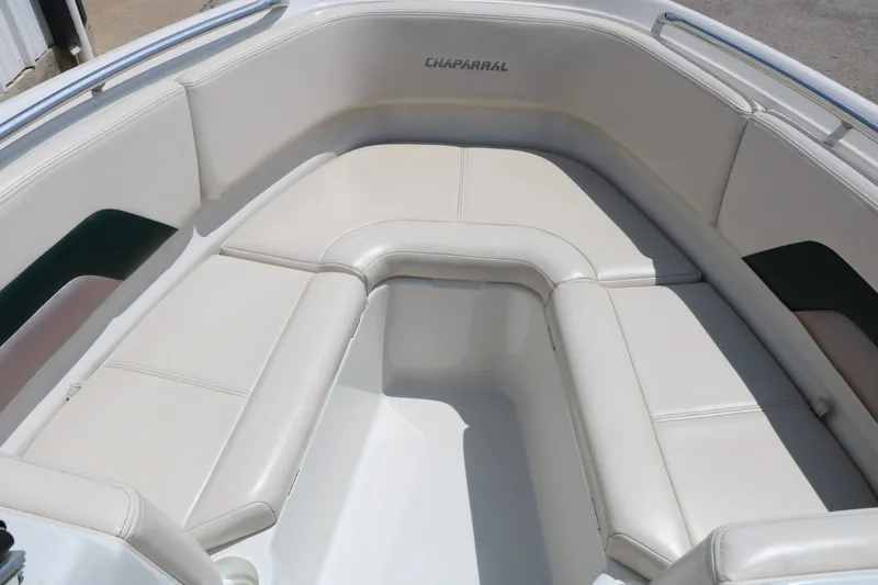 Slide: The Image of 1997 Chaparral 2130 SS boat interior with white cushioned seating. - 25