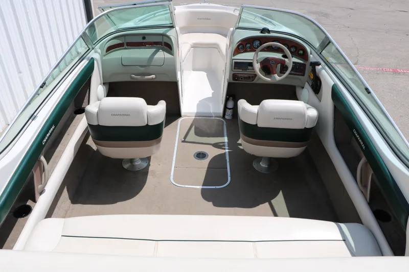 Slide: The Image of 1997 Chaparral 2130 SS boat interior with dual seats and steering wheel. - 22