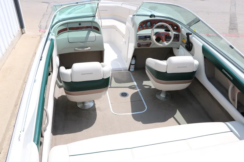 Slide: The Image of 1997 Chaparral 2130 SS boat interior with dual seats and dashboard view. - 19
