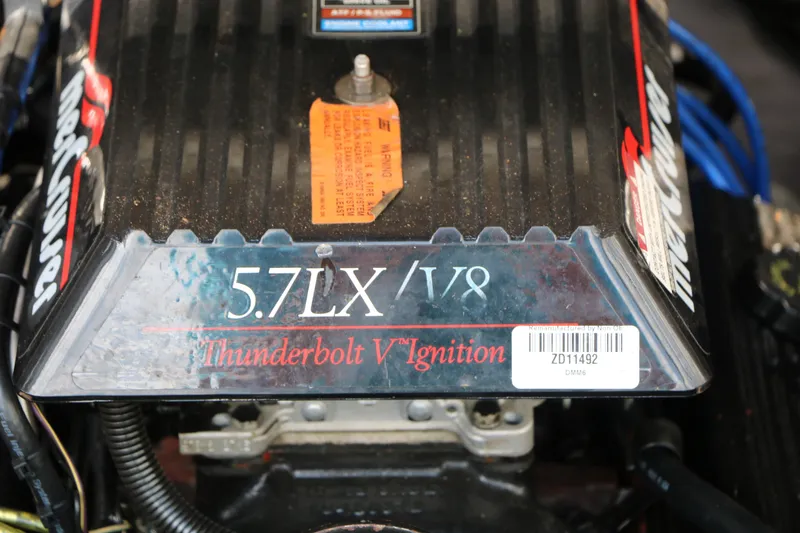 Slide: The Image of Engine cover of a 1997 Chaparral 2130 SS with 5.7LX V8 Thunderbolt V Ignition. - 46