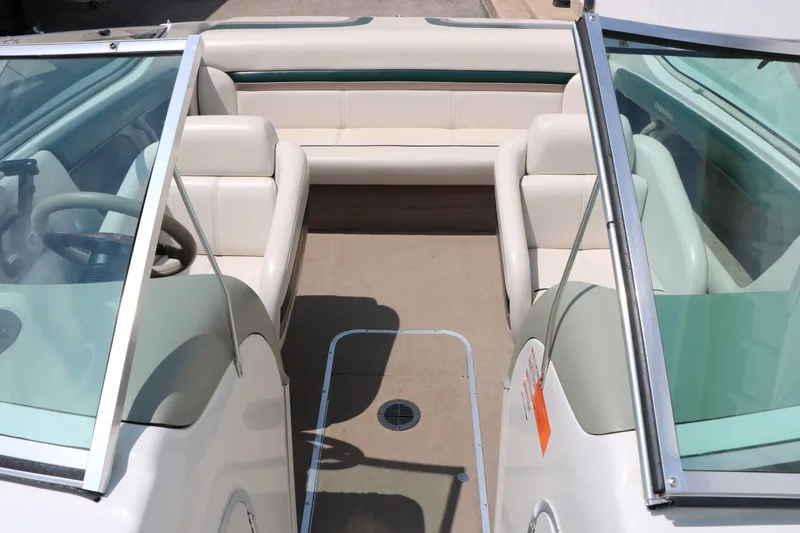 Slide: The Image of 1997 Chaparral 2130 SS boat interior with white seating and open cockpit design. - 30