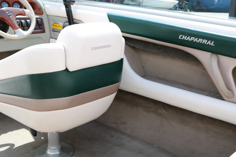 Slide: The Image of Interior of a 1997 Chaparral 2130 SS boat with green and white seating. - 36