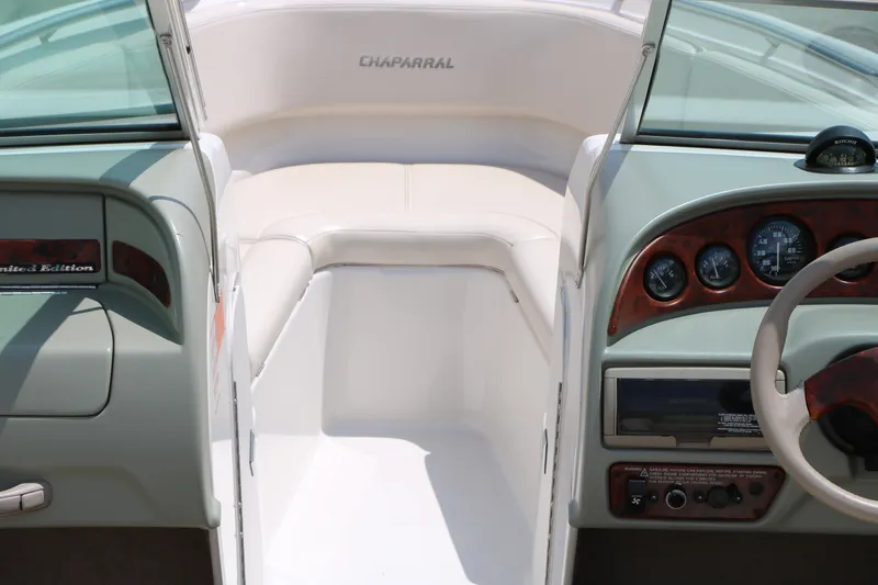 Slide: The Image of Interior of a 1997 Chaparral 2130 SS boat, featuring dashboard and seating area. - 23