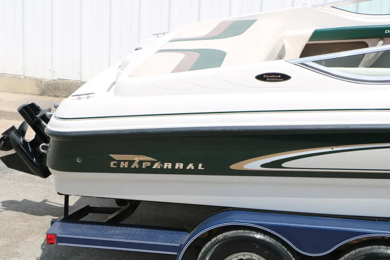 Slide: The Image of 1997 Chaparral 2130 SS boat on trailer, featuring sleek design and limited edition badge. - 16