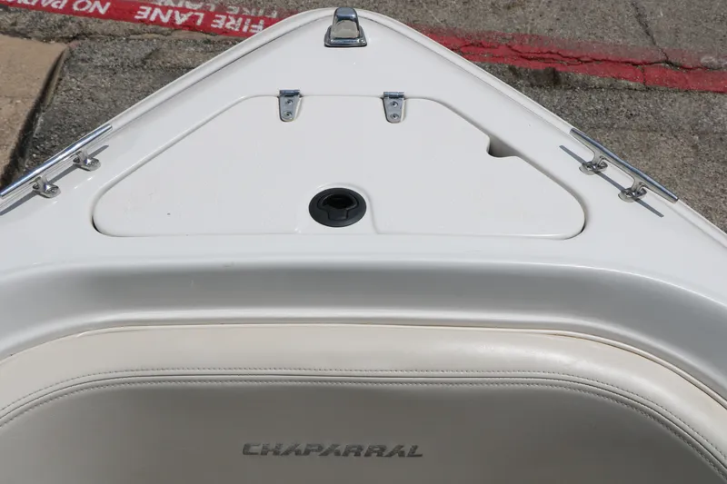 Slide: The Image of Bow of 1997 Chaparral 2130 SS boat with white seating and storage compartment. - 29