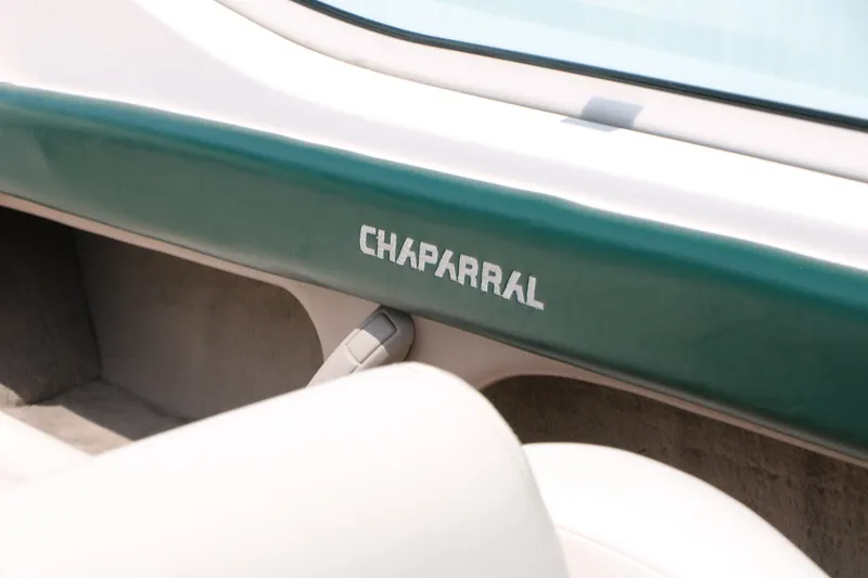 Slide: The Image of 1997 Chaparral 2130 SS boat interior with green trim and logo. - 33