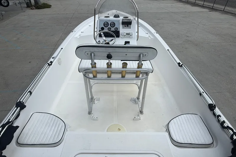 Slide: The Image of 2004 Sea Fox 225 Bay Fisher boat interior with steering console and seating. - 8