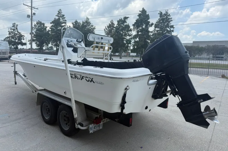 Slide: The Image of 2004 Sea Fox 225 Bay Fisher boat on trailer, parked outdoors. - 5