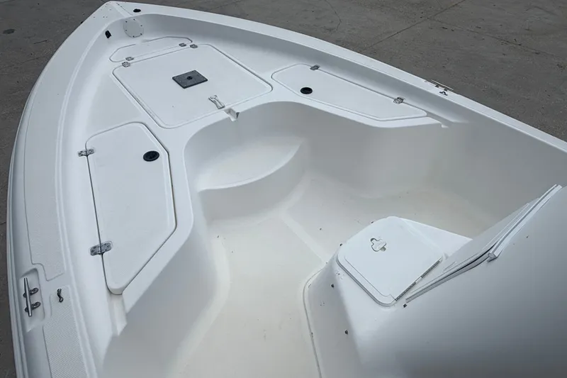 Slide: The Image of 2004 Sea Fox 225 Bay Fisher boat deck with storage compartments. - 10