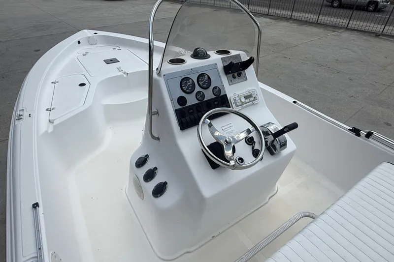 Slide: The Image of 2004 Sea Fox 225 Bay Fisher boat interior with steering console and seating. - 9