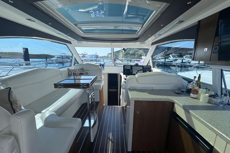 Slide: The Image of Luxurious interior of 2012 Cruisers Yachts 41 Cantius with elegant seating and panoramic windows. - 16