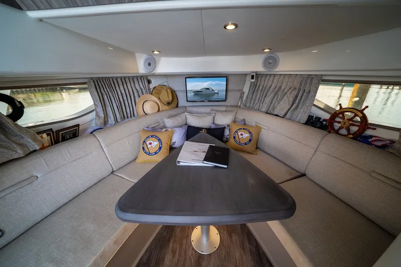 Slide: The Image of Luxurious interior of 2025 Sea Ray Sundancer 320 Outboard yacht with elegant seating and decor. - 24