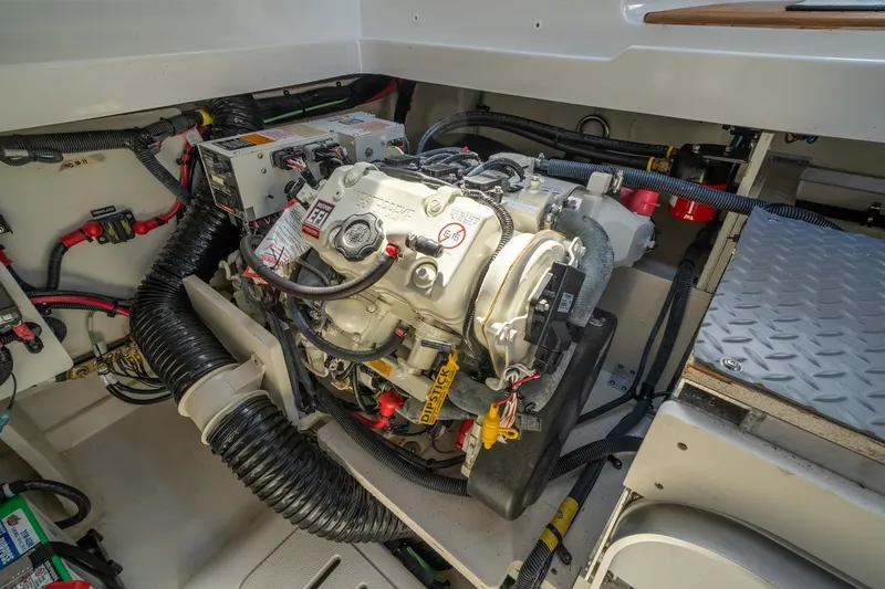 Slide: The Image of Engine compartment of 2025 Sea Ray Sundancer 320 Outboard, showcasing detailed mechanical components. - 29