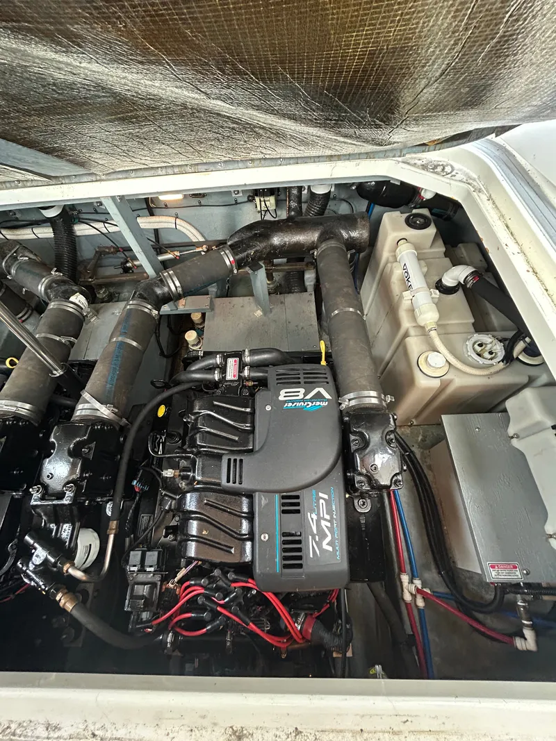 Slide: The Image of The engine compartment of a 1999 Sea Ray 340 Sundancer shows a well-maintained engine. - 29