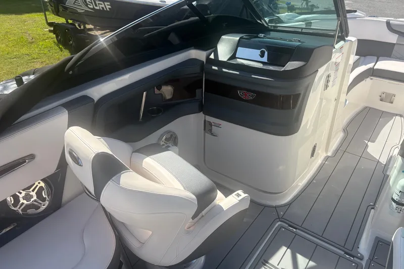 Slide: The Image of Interior of 2021 Chaparral 267 SSX boat with modern seating and dashboard. - 12