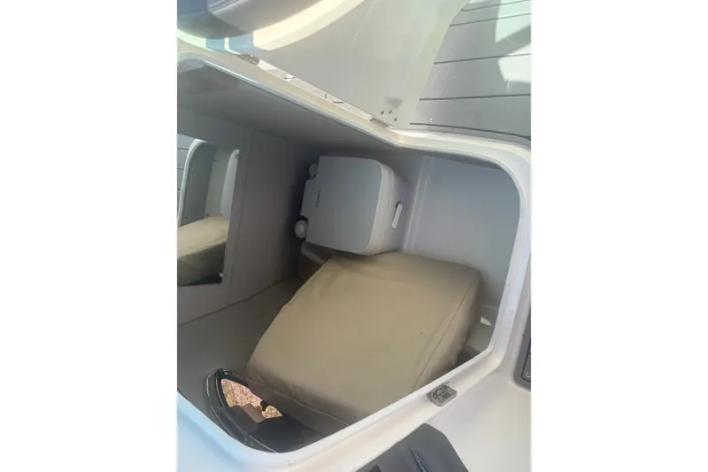 Slide: The Image of Interior cabin of 2021 Chaparral 267 SSX boat, featuring seating and storage. - 13